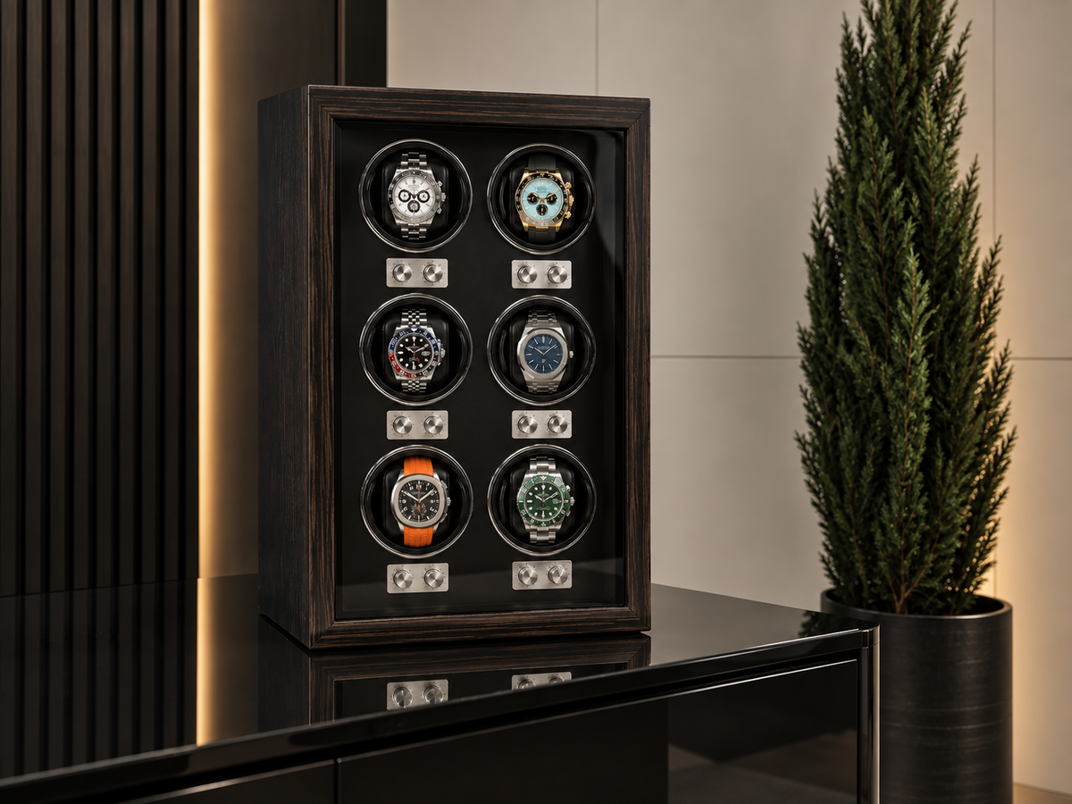 Luxury six-watch automatic watch winder in dark wood finish displayed in a premium modern interior.